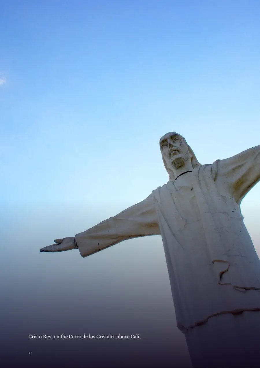 Full-page photograph of Cristo Rey over Cali
